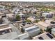 An aerial view shows modern homes with solar panels, shared driveways, and community parking in a developed neighborhood at 7476 Opal Star St, North Las Vegas, NV 89084