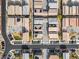 An aerial view shows a well-planned community layout with consistent architecture, parking areas, and landscaping at 7476 Opal Star St, North Las Vegas, NV 89084