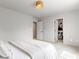 Cozy bedroom with a minimalist design, featuring a closet and carpet floors at 7476 Opal Star St, North Las Vegas, NV 89084