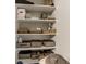 Storage closet featuring several white shelves, organizing an assortment of baskets, bins, and personal items at 7476 Opal Star St, North Las Vegas, NV 89084