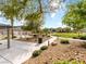 Inviting common area with lush desert landscaping, walkways, and community pool in the background at 7476 Opal Star St, North Las Vegas, NV 89084