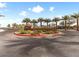 Elegant 'Galaxy Park' entrance featuring vibrant landscaping and palm trees, offering a welcoming ambiance at 7476 Opal Star St, North Las Vegas, NV 89084