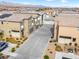 A modern home featuring desert landscaping and a shared driveway, showcasing contemporary design in a community setting at 7476 Opal Star St, North Las Vegas, NV 89084