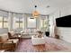 Comfortable living room with neutral tones, stylish decor, and ample natural light at 7476 Opal Star St, North Las Vegas, NV 89084