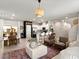 Inviting living space featuring an open layout, modern kitchen, and stylish furnishings at 7476 Opal Star St, North Las Vegas, NV 89084