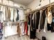 This walk-in closet features an abundance of hanging racks and shelving for organization at 7476 Opal Star St, North Las Vegas, NV 89084