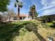 Lush backyard with healthy grass and shade trees enhance this home's charm at 8072 Hackberry Dr, Las Vegas, NV 89123