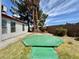 Backyard featuring a deck with grass and some trees at 8072 Hackberry Dr, Las Vegas, NV 89123
