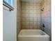 Bright bathroom features a shower with tiled walls and silver fixtures at 8072 Hackberry Dr, Las Vegas, NV 89123