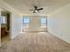Spacious main bedroom with ceiling fan, carpet flooring, and two windows at 8072 Hackberry Dr, Las Vegas, NV 89123