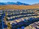 Aerial view of a modern home with a sparkling pool and spa in a vibrant neighborhood at 818 Laceleaf St, Las Vegas, NV 89138