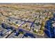 Aerial view showcasing a modern home with desert landscaping in a neatly planned community at 818 Laceleaf St, Las Vegas, NV 89138