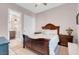 Bedroom with neutral walls, decorative carpet and a dark wood bed frame at 818 Laceleaf St, Las Vegas, NV 89138