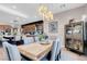 Open-concept dining area next to the kitchen, featuring modern light fixture at 818 Laceleaf St, Las Vegas, NV 89138