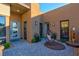 A front patio featuring a hanging chair, stone pavers and greenery at 818 Laceleaf St, Las Vegas, NV 89138