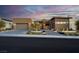 Stunning contemporary home featuring desert landscaping, a two-car garage, and a paved driveway at 818 Laceleaf St, Las Vegas, NV 89138