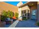 The front porch has stone pavers and features outdoor seating at 818 Laceleaf St, Las Vegas, NV 89138