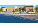 Modern single-story home with desert landscaping, paver driveway and an attached garage at 818 Laceleaf St, Las Vegas, NV 89138