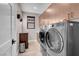 Spacious laundry room with modern washer and dryer and convenient storage at 818 Laceleaf St, Las Vegas, NV 89138