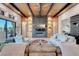 Inviting living room featuring a fireplace, custom built-ins, and an abundance of natural light at 818 Laceleaf St, Las Vegas, NV 89138