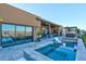 Stunning pool and spa with comfortable seating and an elegant patio for outdoor entertaining at 818 Laceleaf St, Las Vegas, NV 89138