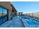 Resort-style pool area with comfortable seating, a covered patio, and views of the neighborhood at 818 Laceleaf St, Las Vegas, NV 89138