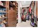 Walk-in closet with dark wood shelving and storage for clothes and shoes at 818 Laceleaf St, Las Vegas, NV 89138