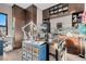 Work room with custom cabinetry and storage, lots of desk space and natural light at 818 Laceleaf St, Las Vegas, NV 89138
