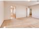 Spacious bedroom with neutral carpet and two entryways into the bathroom and hallway at 8205 Celina Hills St, Las Vegas, NV 89131