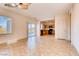 Bright living room area with tile floors and backyard view; open to the kitchen, creating a spacious feel at 8205 Celina Hills St, Las Vegas, NV 89131