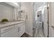 Chic bathroom showcasing a modern vanity, well-lit mirror, and stylish fixtures at 845 Loch Katrine Ave, Henderson, NV 89012