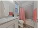 Well-lit bathroom featuring a shower-tub combination and a modern vanity with a sleek countertop at 845 Loch Katrine Ave, Henderson, NV 89012