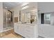 Well-lit bathroom showcasing a glass-enclosed shower and contemporary vanity at 845 Loch Katrine Ave, Henderson, NV 89012
