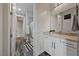 Tasteful bathroom featuring a modern vanity, mirror, and stylish fixtures and hardware at 845 Loch Katrine Ave, Henderson, NV 89012