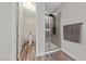 Clean and modern bathroom design with a glass shower, toilet, and sleek fixtures at 845 Loch Katrine Ave, Henderson, NV 89012
