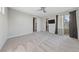 Light-filled bedroom with plush carpet, a closet, sliding glass doors to the exterior, and neutral paint at 845 Loch Katrine Ave, Henderson, NV 89012