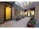 Inviting courtyard featuring a decorative walkway, elegant planters, and a well-lit entrance at 845 Loch Katrine Ave, Henderson, NV 89012