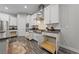 Modern kitchen featuring gas range, stainless appliances, pull out drawers and stylish cabinets at 845 Loch Katrine Ave, Henderson, NV 89012