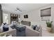 Stylishly staged living room featuring comfortable seating and modern decor at 845 Loch Katrine Ave, Henderson, NV 89012