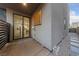 Cozy patio area with a sliding glass door, rock garden, and stepping stone path at 845 Loch Katrine Ave, Henderson, NV 89012