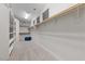 Spacious walk-in closet with ample shelving, rods, and a small window at 845 Loch Katrine Ave, Henderson, NV 89012