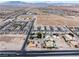 Wide aerial shot displaying the community, street layout and distant mountains at 8690 W Ford Ave, Las Vegas, NV 89148