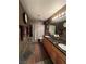 The bathroom features a double sink, shower, decorative mirror, and vanity at 8690 W Ford Ave, Las Vegas, NV 89148