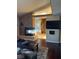 Open floorplan featuring a living area fireplace and ensuite bathroom at 8690 W Ford Ave, Las Vegas, NV 89148