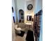 A full bathroom boasts a pedestal sink, toilet and shower with dark-themed fixtures and décor at 8690 W Ford Ave, Las Vegas, NV 89148