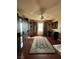 Spacious bedroom features hardwood floors, a ceiling fan, and closet at 8690 W Ford Ave, Las Vegas, NV 89148