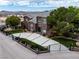 Handsome two-story brick home with a gated driveway and mature trees at 8690 W Ford Ave, Las Vegas, NV 89148