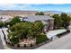 Beautiful exterior view of home with lush landscaping, water feature, mature trees and mountain backdrop at 8690 W Ford Ave, Las Vegas, NV 89148