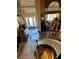 Spacious foyer with a winding staircase and views of the living room and front entrance, decorated for Christmas at 8690 W Ford Ave, Las Vegas, NV 89148