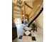 Stunning foyer with high ceilings, elegant chandelier, and grand staircase adds sophistication at 8690 W Ford Ave, Las Vegas, NV 89148